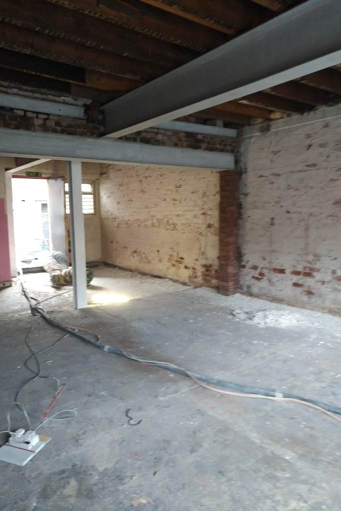 building work taking place inside a building showing ceiling