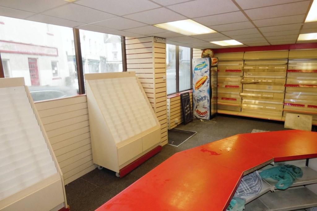 the interior of a newsagents commercial property offered for lease