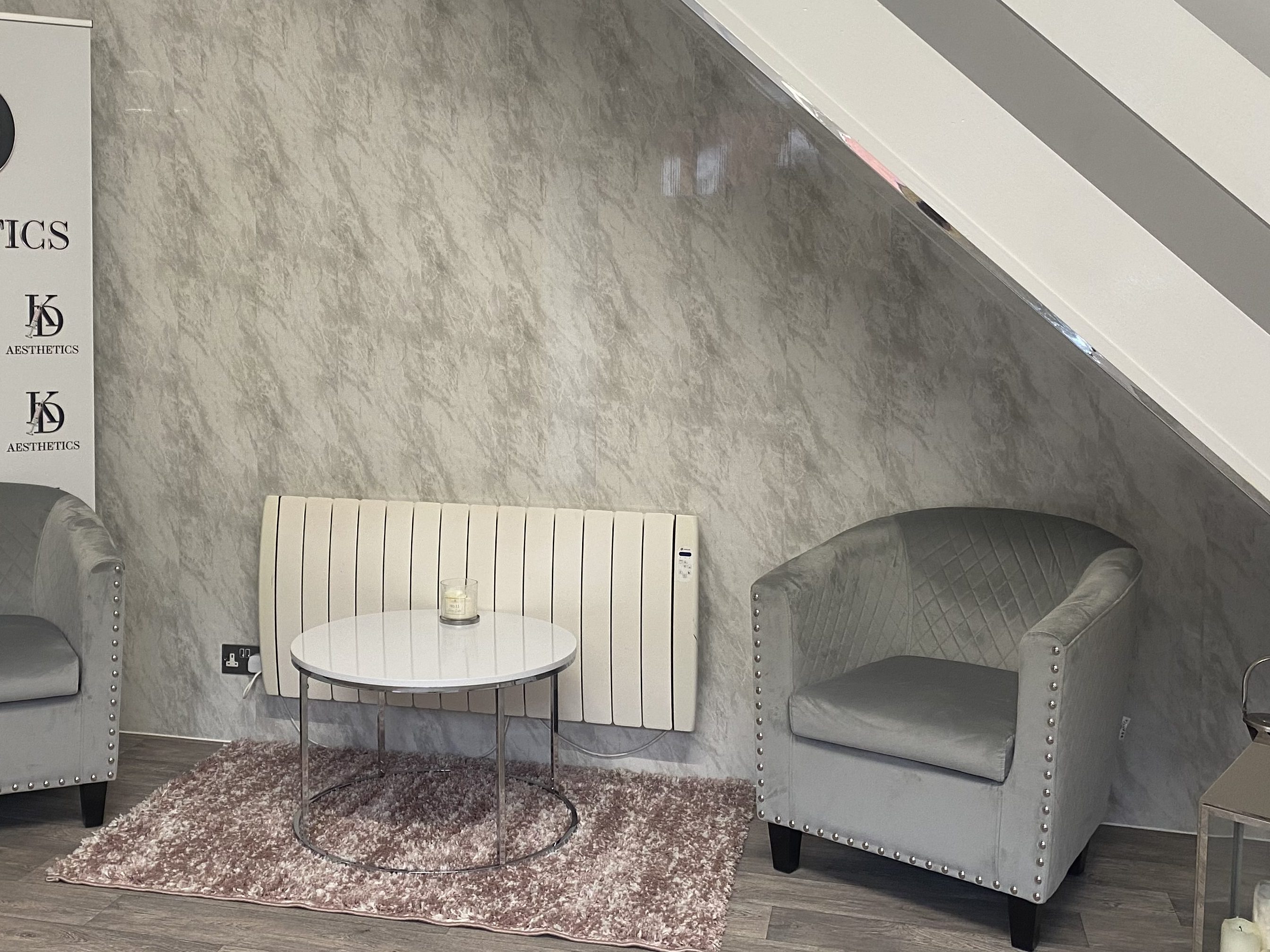 close up of the inside of an office reception area with table and chairs