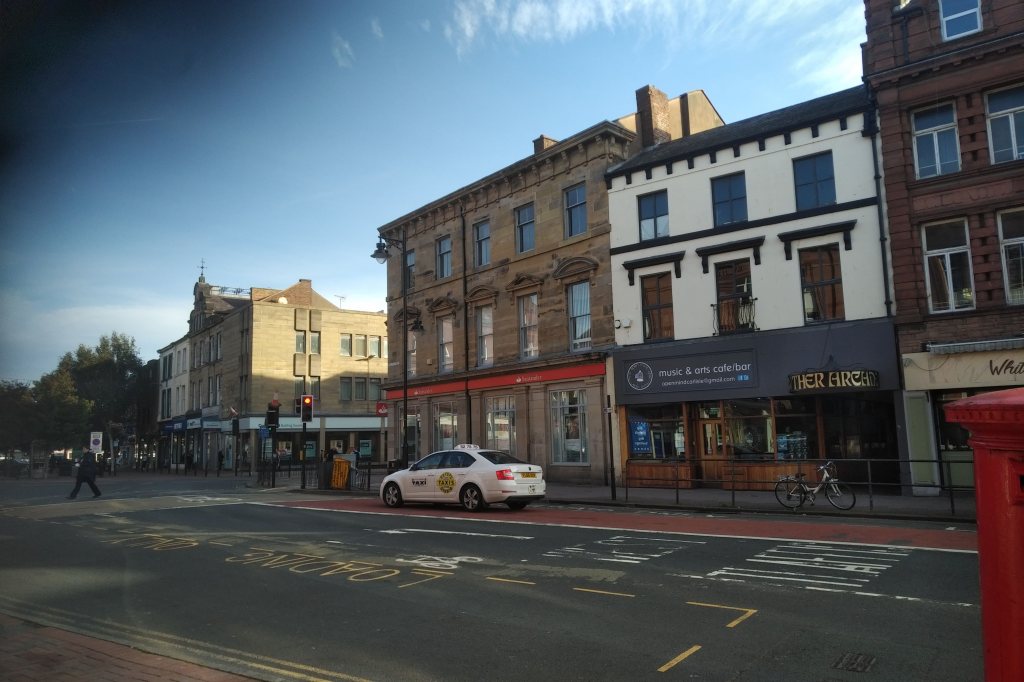 High street scene showing fronts of shop premises