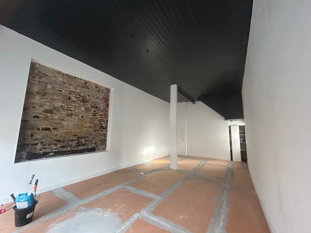 interior of an empty commercial shop undergoing refurbishment.